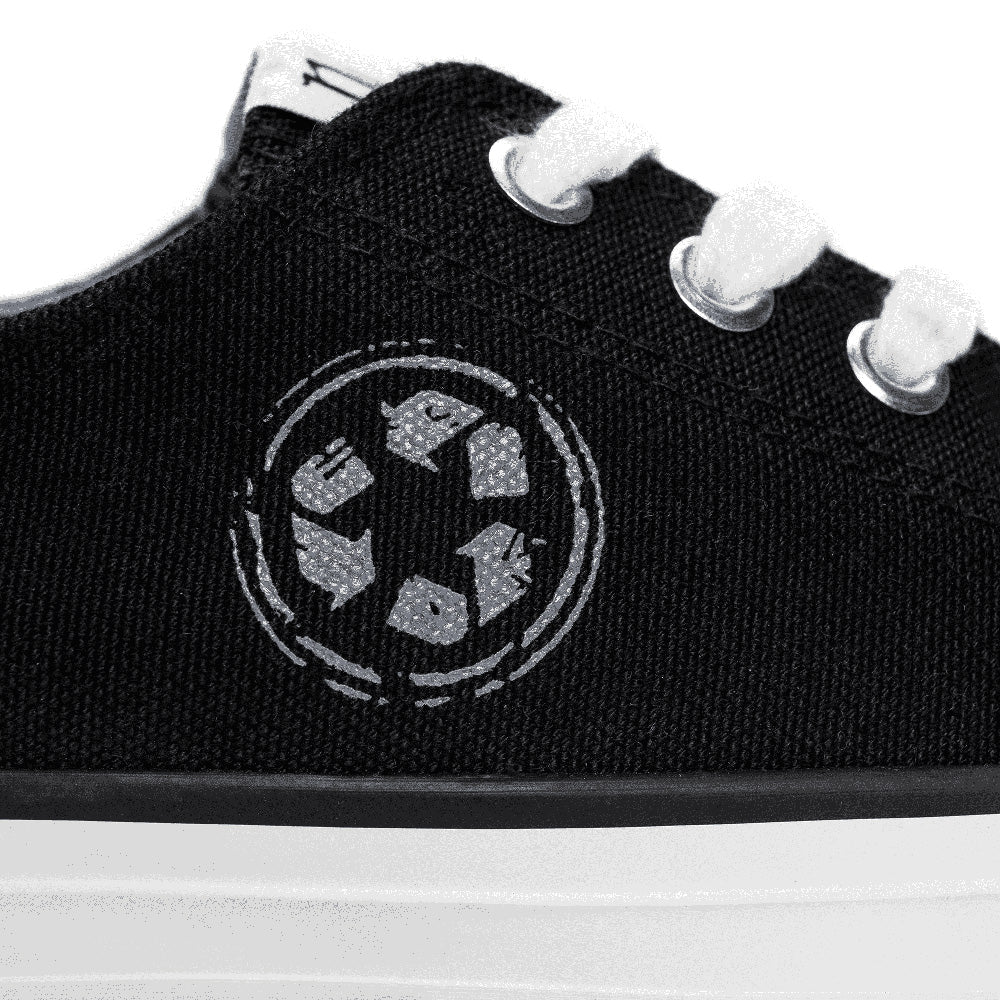 Recycled label printed on vegan black trainers low top | NAE Vegan Shoes