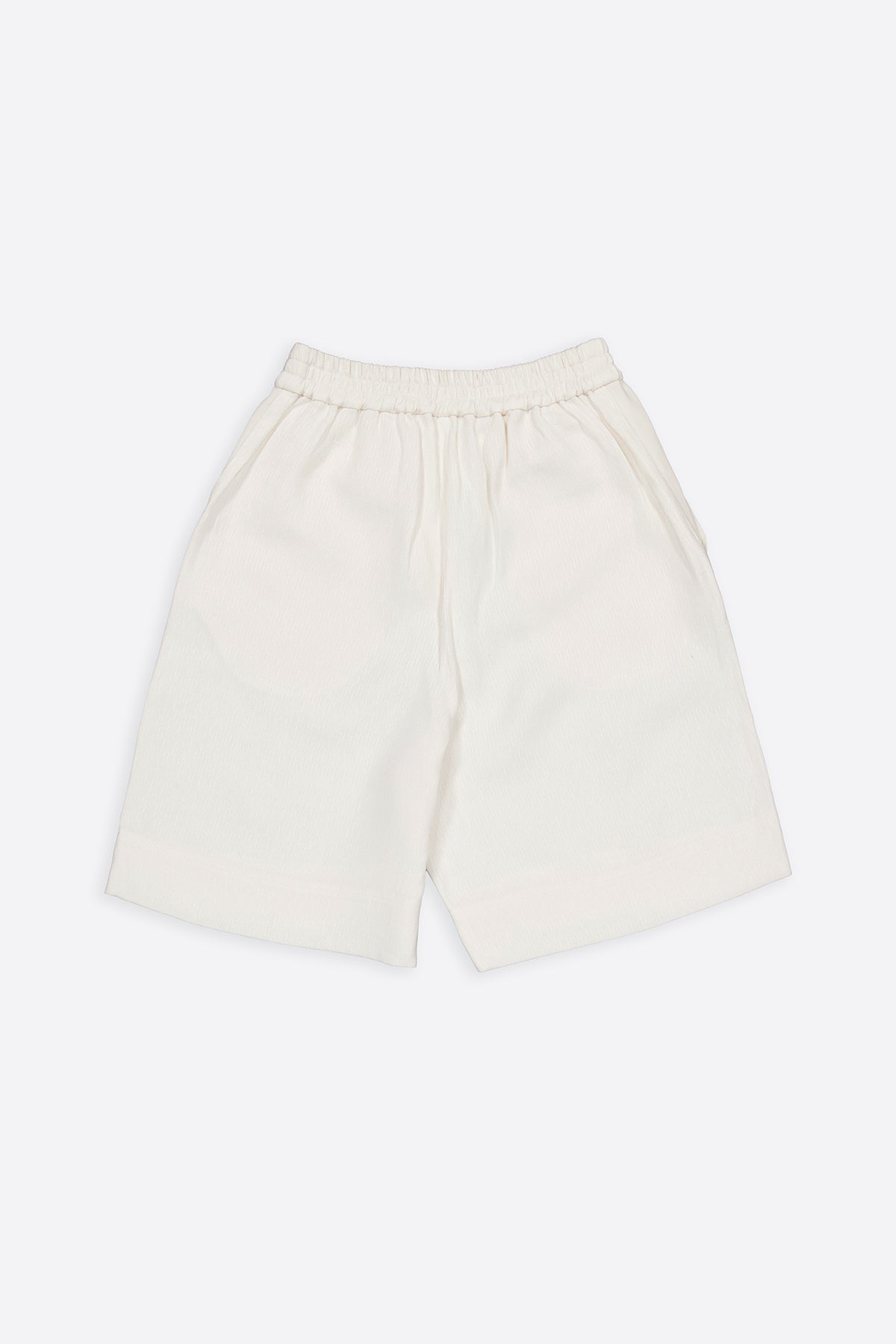 The textured shorts have minimal modern aesthetics design allowing comfort and bringing self-confidence. This unique piece is made locally in Paris to reduce environmental impact and guarantee high quality and durability of the products.
