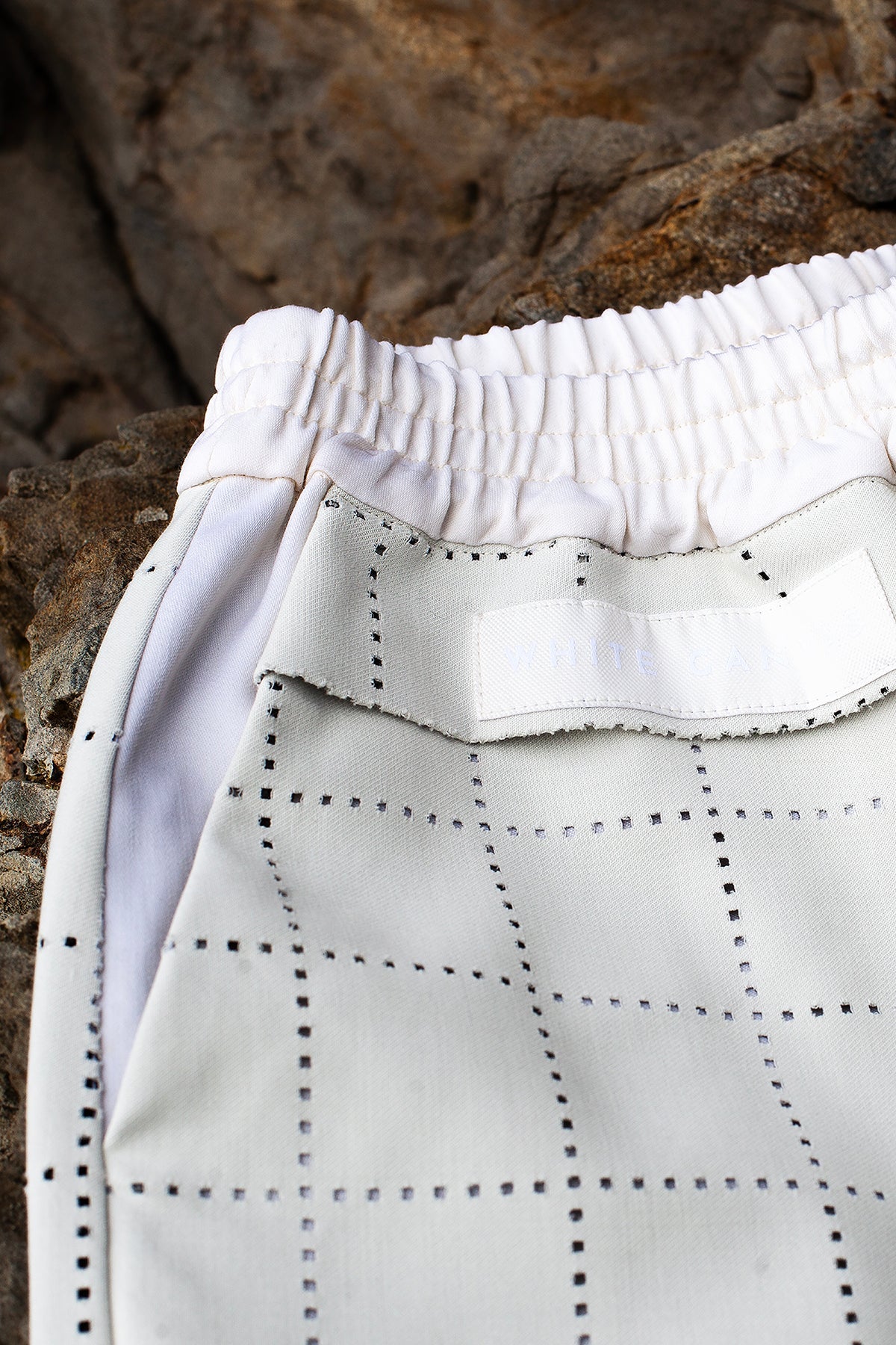 White Canvas sustainable light grey color, genderless, seasonless casual checks trousers, size S. The Essential checks trousers have minimal modern aesthetics design allowing comfort and bringing self-confidence. This unique piece is made locally in Paris to reduce environmental impact and guarantee high quality and durability of the products.