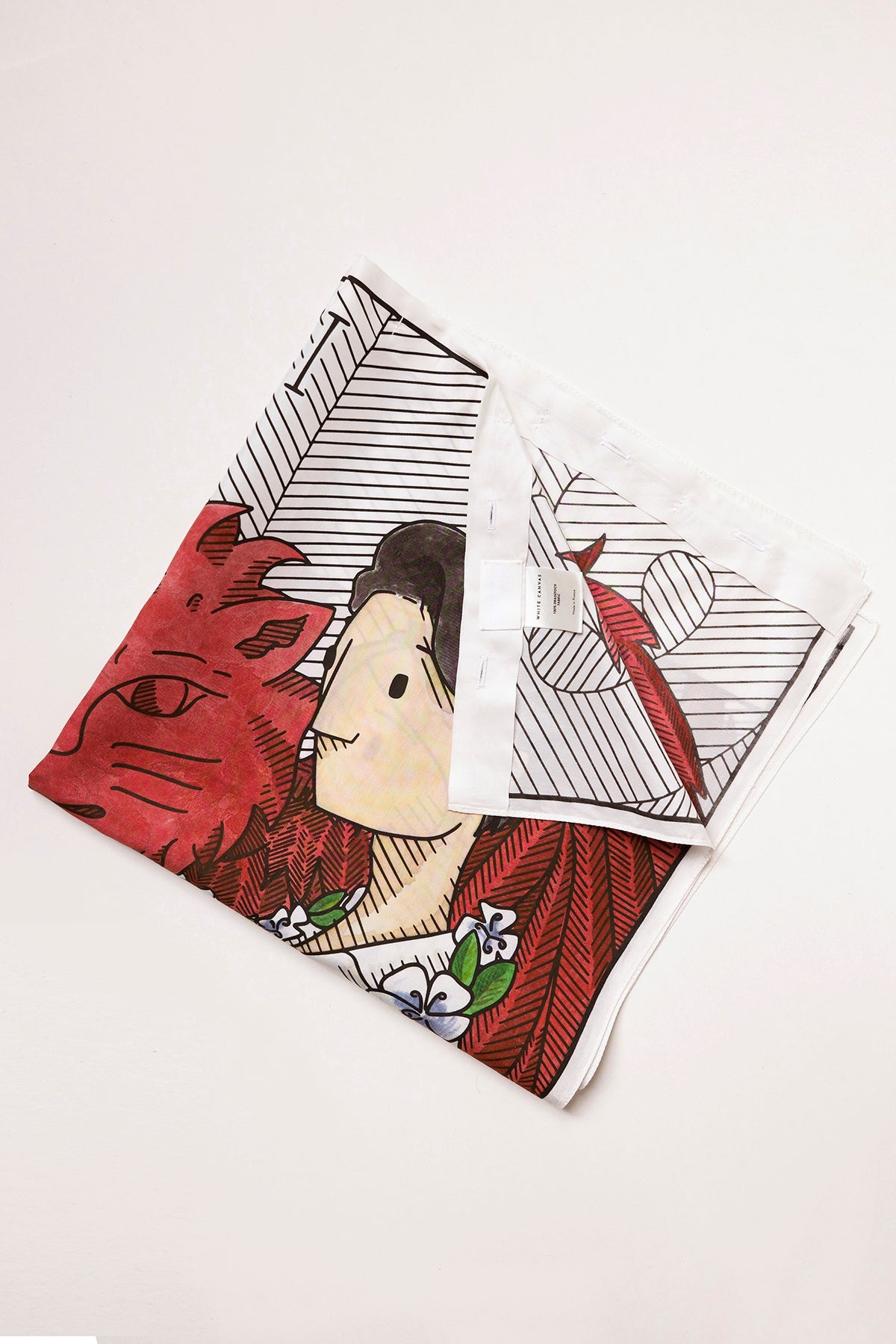 THE TWO OF CUPS foulard and square panel is made from leftover deadstock silk fabric The foulard has an exclusive design inspired by tarot cards drawn by the artist Maria Robla, printed with black artisanal eco-friendly ink locally in Paris and hand painted by the artist. Wear the foulard alone or attach it to the essential pieces to personalize them and wear them your unique way. Your perfect summer accessory. White Canvas x Maria Robla.