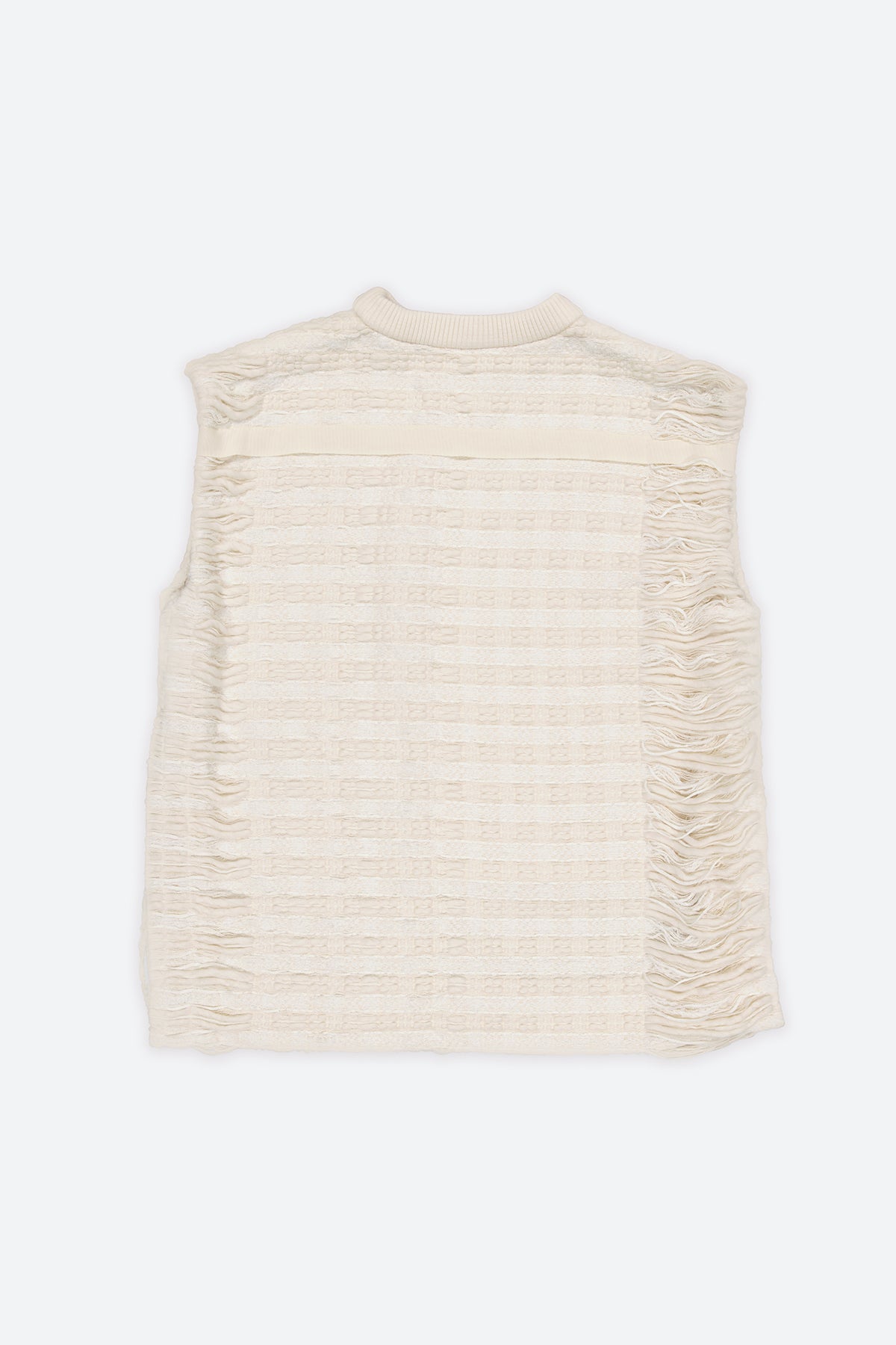 The artisanal sleeveless sweater is a mix of tweed fabrics from luxury houses deadstock. This unique piece is made locally in Paris to reduce environmental impact and guarantee high quality and durability of the products. It is gender neutral, has oversize fit and has a minimal impact on environment.