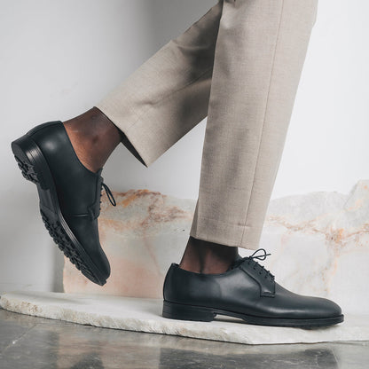 Men black blucher shoes crafted from vegan leather wearing pants | NAE Vegan Shoes