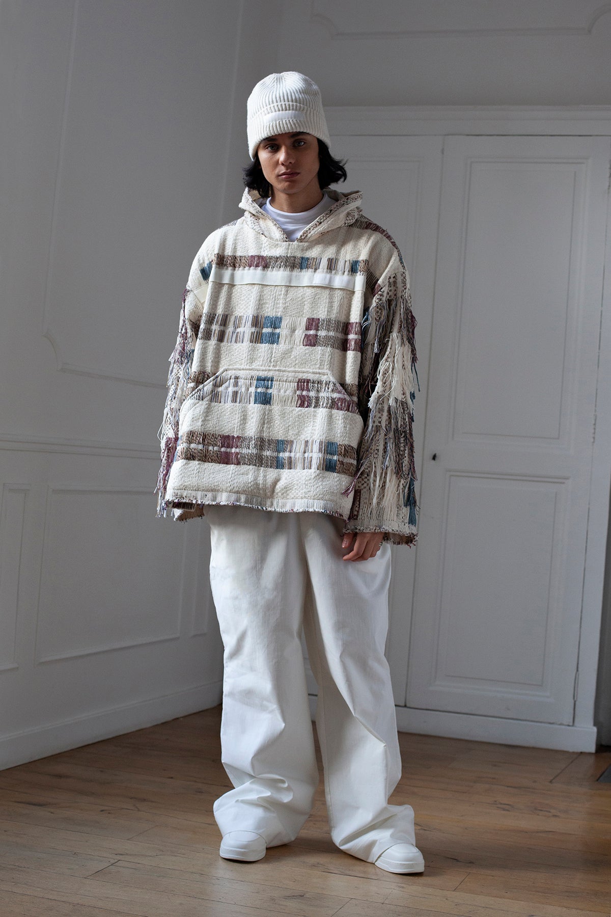 The artisanal fringe hoody is a mix of tweed fabrics from luxury houses deadstock. This unique piece is made locally in Paris to reduce environmental impact and guarantee high quality and durability of the products. It is gender neutral, has oversize fit and has a minimal impact on environment. 